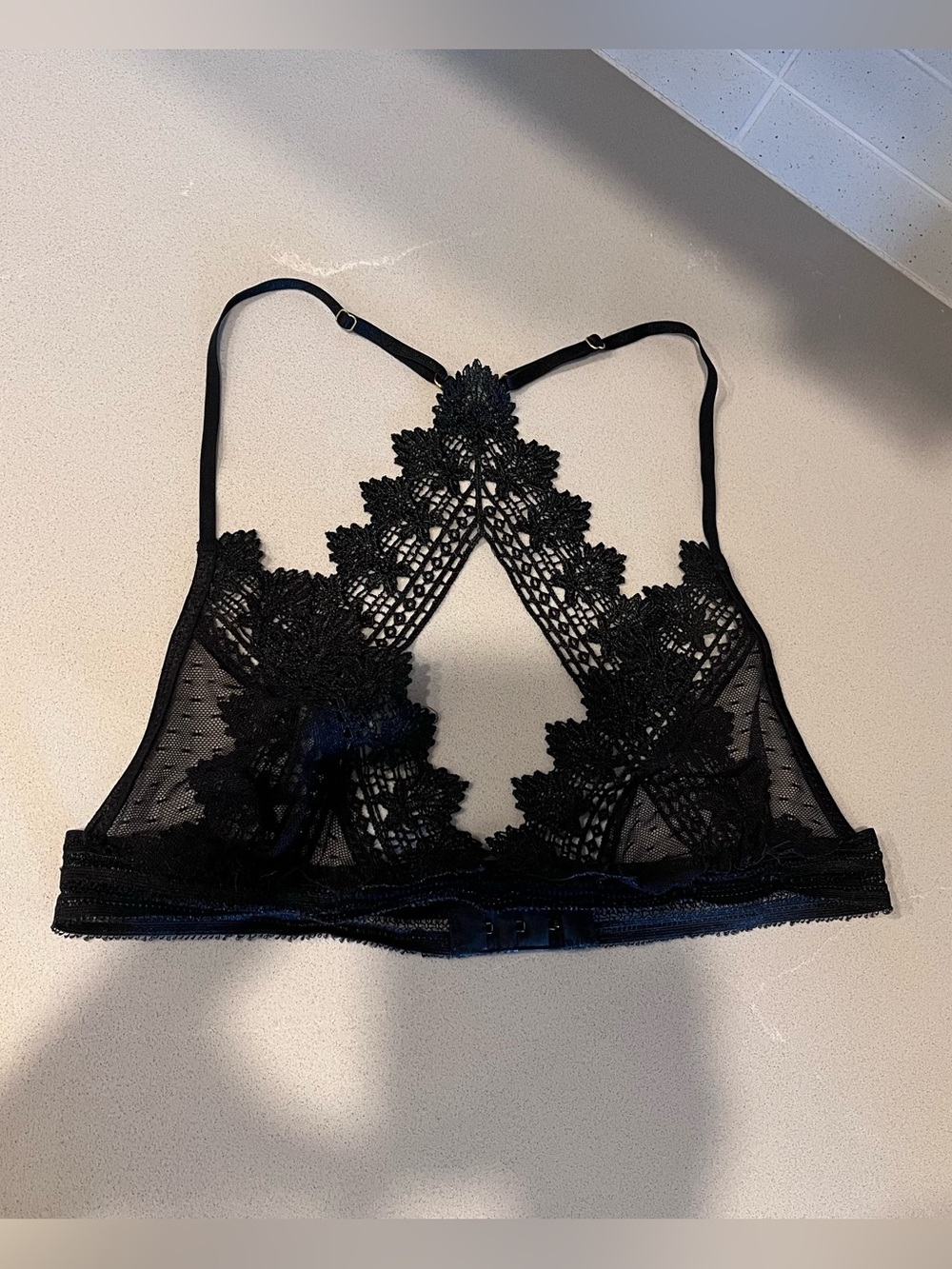 Black sheer lace bralette, size small, cross racerback design, adjustable straps
